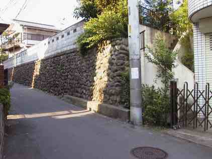 Grey stone contrasts with white tile